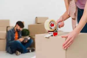 packing-boxes-with-building-tape-order-move-new-housing_23-2148095501.webp
